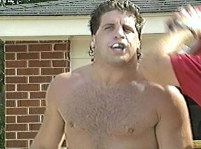 TRAINER REMOVES PETER McNEELEY's HEADGEAR