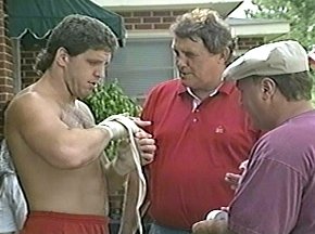 PETER McNEELEY WRAPS HAND AS TRAINERS LOOK ON - IMAGE#3