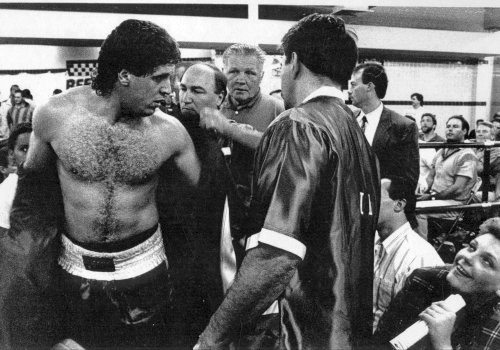 HEAVYWEIGHT BOXER PETER McNEELEY SURROUNDED BY FANS AFTER WINNING FIGHT