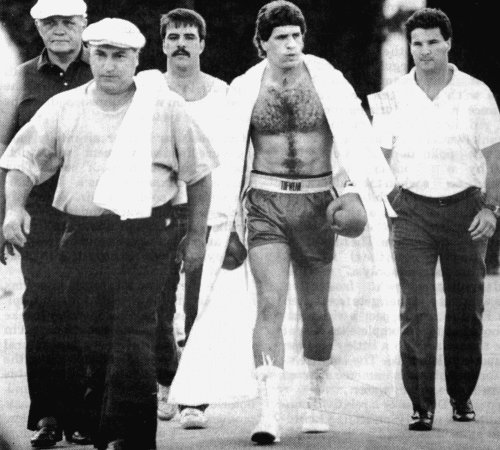 PETER McNEELEY AND HIS ENTOURAGE HEAD FOR THE RING