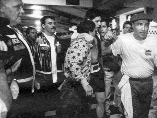 BOXER PETER McNEELEY SURROUNDED BY HIS TEAM