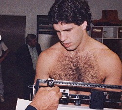 PETER McNEELEY STEPS ON THE SCALE AT THE WEIGH-IN