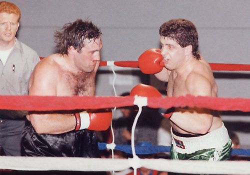 PETER McNEELEY UNLOADS A RIGHT HAND ON MARC MACHAIN'S HEAD